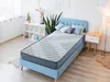 A mattress is placed on a bed frame in a room. Produktbild-Vorschau