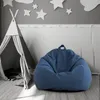 A child's room with a teepee tent and a blue beanbag chair. Voir les images du produit