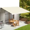 An outdoor patio scene with a table and chairs under a cream-colored awning. Produktbild-Vorschau