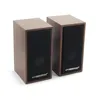 Two brown speakers are shown against a white background. Anteprima dell’immagine prodotto