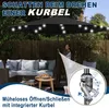 A woman is operating a patio umbrella with integrated LED lights and a crank mechanism, set in an outdoor patio area with furniture. Produktbild-Vorschau