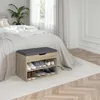 A shoe bench with storage is placed next to a bed in a bedroom. Náhled obrázku produktu