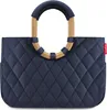 A studio shot of a navy blue quilted shopper bag with gold handles. Produktbild-Vorschau
