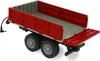 A red toy trailer with dual wheels, shown from a slightly elevated side angle on a white background. Produktbild-Vorschau