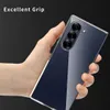A hand holding a clear phone case over a dark background. Produktbild-Vorschau