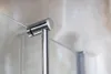 Close-up of a chrome towel holder attached to a glass panel. Produktbild-Vorschau