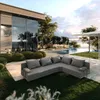 A modern outdoor living space with a sectional sofa, swimming pool, and a view of the water. Podgląd zdjęcia produktu
