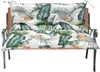 A cushion set for a bench or swing, with a tropical leaf pattern. Produktbild-Vorschau