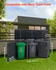 A trash can enclosure with two bins, set up in a backyard with a modern house in the background. Produktbild-Vorschau