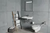 A modern bathroom with a sink, toilet, and towel rack. Anteprima dell’immagine prodotto