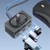 A black USB hub with multiple ports and a mouse are shown on a reflective blue and gray surface. Produktbild-Vorschau