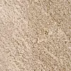 A close-up, textured view of a beige carpet. Produktbild-Vorschau