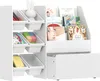 A white children's storage unit with shelves and bins, filled with books and toys. Produktbild-Vorschau