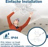 A man installing a ceiling light fixture. Náhled obrázku produktu