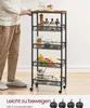 A person is standing next to a rolling cart filled with kitchen items. The cart has a wooden top and multiple shelves with mesh baskets. Produktbild-Vorschau
