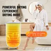 A woman in a bathrobe and towel is sitting on the edge of a bathtub next to a towel warmer in a bathroom. Voir les images du produit