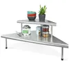 A two-tiered corner shelf unit made of stainless steel, displaying various kitchen items. Produktbild-Vorschau