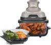 A Ninja CRISPi air fryer with a glass cooking pot filled with chicken wings and a separate glass dish with broccoli and salmon. Anteprima dell’immagine prodotto