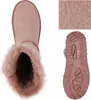 A top-down view of a pink boot with a close-up of the fur texture and a view of the sole. Produktbild-Vorschau