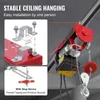 Close-up view of a red electric hoist with mounting hardware and a stop device, with text overlays highlighting features. Náhľad obrázku produktu