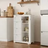 A white storage cabinet with four drawers and a door, placed in a kitchen or bathroom setting. Náhled obrázku produktu