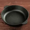 A black cast iron pan on a wooden surface. Produktbild-Vorschau