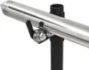 Close-up of a metal roller mechanism attached to a black pole, supporting a shiny metal tube. Náhled obrázku produktu