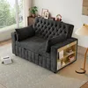 A dark gray sofa bed with tufted backrest and built-in side shelves is shown in a living room setting. Produktbild-Vorschau
