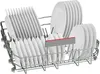 A dishwasher rack filled with white plates. Voir les images du produit