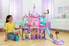 A young girl plays with a Disney Princess castle playset in a room. Podgląd zdjęcia produktu