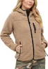 A woman wearing a camel-colored teddy fleece jacket. Produktbild-Vorschau