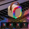 A portable speaker with RGB lighting sits on piano keys, with feature icons below. Náhľad obrázku produktu