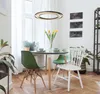 A dining area with a table, chairs, and a pendant light. Produktbild-Vorschau
