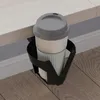 A coffee cup in a holder attached to the side of a desk. Náhled obrázku produktu