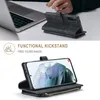 A person's hands are visible in the background, interacting with a laptop. The foreground shows a smartphone in a wallet-style case with a kickstand feature. Produktbild-Vorschau