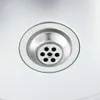 A close-up view of a stainless steel sink drain. Náhľad obrázku produktu