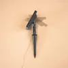 A solar-powered garden light with a stake and a solar panel. Produktbild-Vorschau