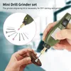 A hand is holding a mini drill grinder and using it to carve a piece of wood. The drill set accessories are shown in a circular inset. Náhled obrázku produktu
