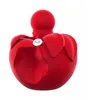 A red perfume bottle shaped like an apple. Voir les images du produit
