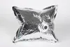 A silver, star-shaped inflatable object with a valve in the center, set against a white background. Produktbild-Vorschau