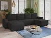 A modern living room with a large U-shaped sectional sofa, a coffee table with decorative items, and large windows with greenery visible outside. Produktbild-Vorschau