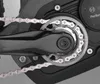 A close-up view of an electric bicycle's chainring and chain, with a Bosch motor visible in the background. Produktbild-Vorschau