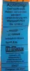 A close-up of a blue label with black text and orange trim, attached to a strap. Produktbild-Vorschau