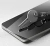 A key is placed on a smartphone screen protector. Produktbild-Vorschau