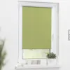 A green roller blind is shown in a window frame. Náhled obrázku produktu