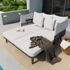 An outdoor lounge area with a modern daybed, plants, and a basket. Podgląd zdjęcia produktu