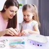 A woman and a young girl are making jewelry together, with a UV light for resin curing visible. Produktbild-Vorschau