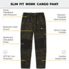 A pair of camouflage cargo pants with feature callouts. Anteprima dell’immagine prodotto