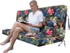 A woman is sitting on a large, colorful outdoor cushion and reading a book. Náhľad obrázku produktu