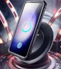 A smartphone in a protective case is shown on a wireless charging pad, with a futuristic, industrial background. Produktbild-Vorschau